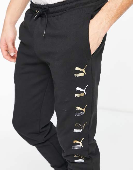 Black and 2025 gold puma joggers