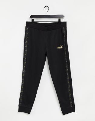 puma tracksuit black and gold