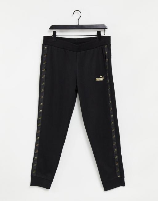 Puma tracksuit store black and gold