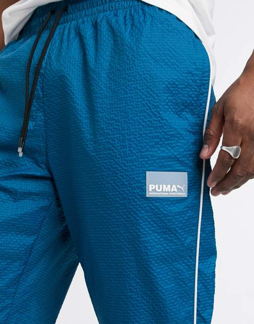 Puma Avenir logo woven sweat pants in blue