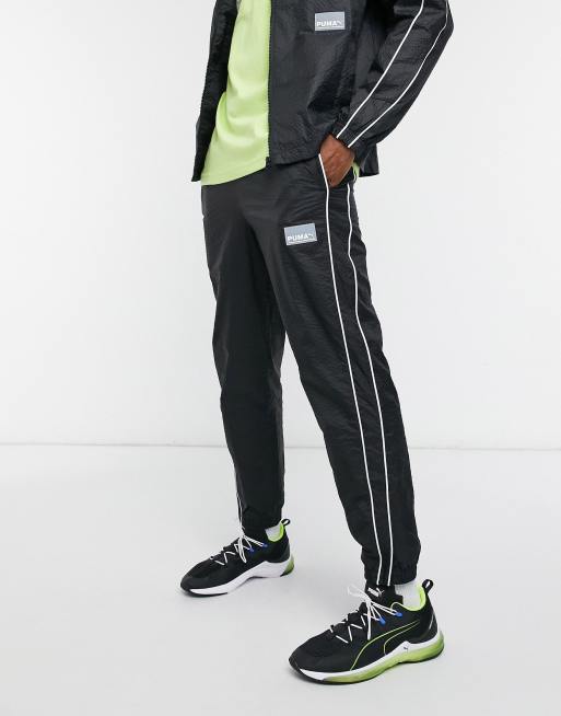 Puma Avenir logo woven sweatpants in black