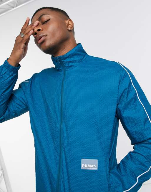 lluvia director Mucama Puma Avenir woven track jacket in blue | ASOS