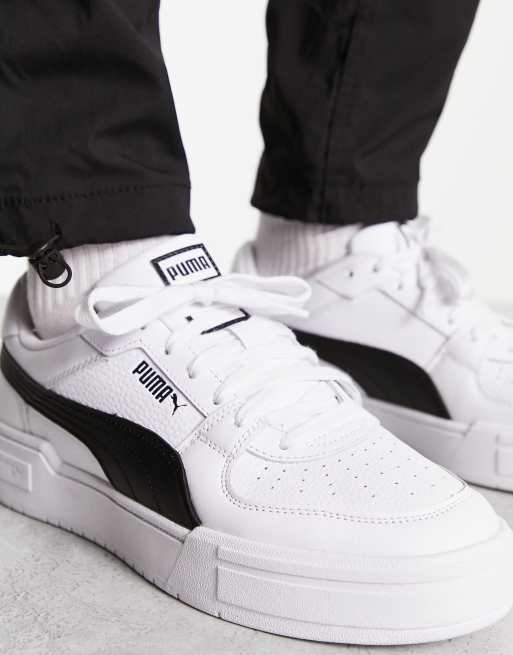 Puma white sale and black trainers