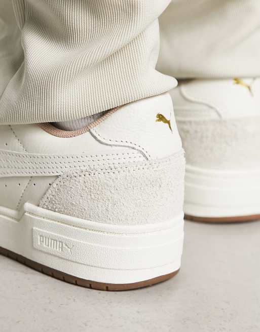 Cream pumas on sale