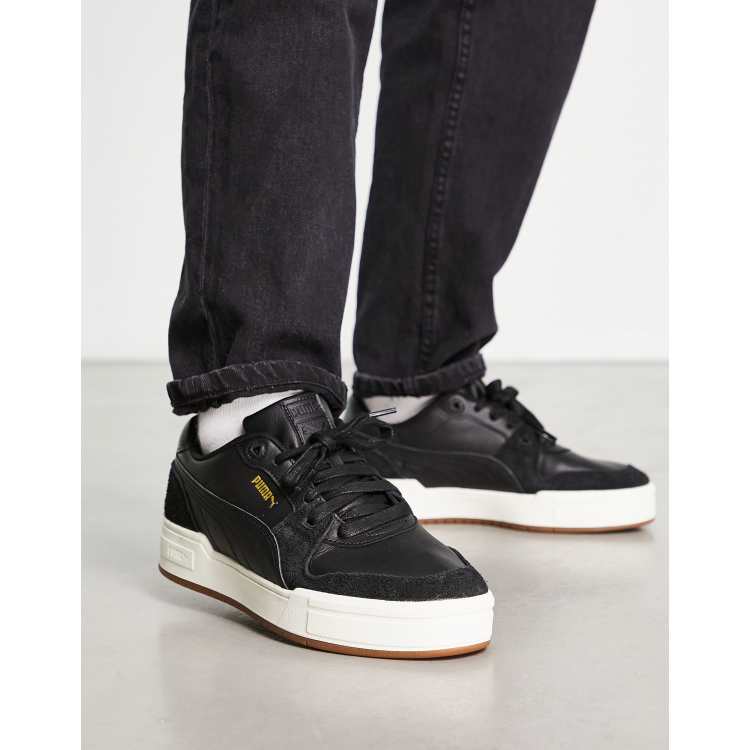 puma ca pro suede trainers in black with gum sole