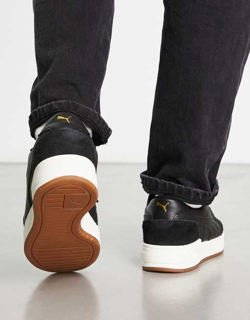puma ca pro suede trainers in black with gum sole