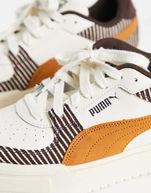 Puma nere clearance con suola marrone