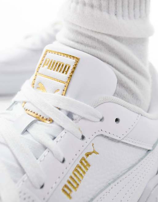 Gold fashion and white high pumas