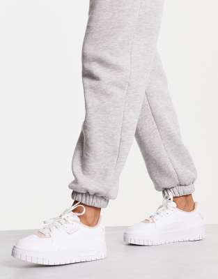 PUMA Cali Dream sneakers in white and pink
