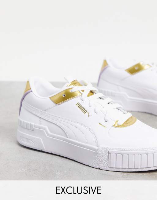 PUMA Cali Sport trainers in white and gold exclusive to ASOS