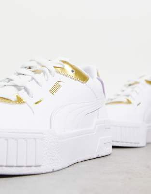 white puma shoes with gold
