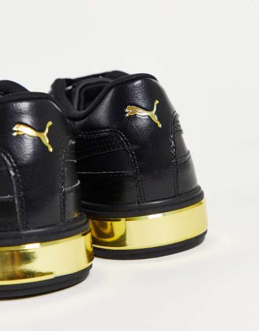 Puma Cali Star Metallic trainers in black and gold