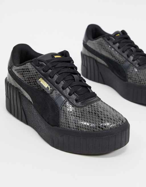 Puma Cali Wedge trainers in black snake