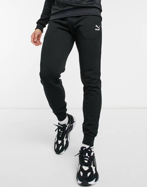 Puma Classics logo sweatpants in black | ASOS