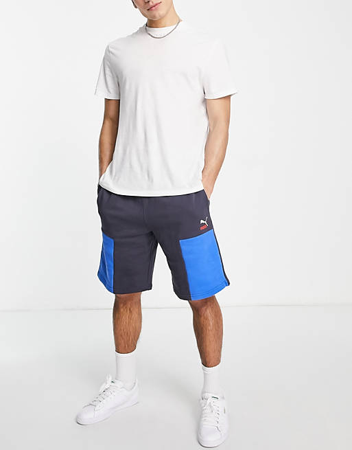 Men Puma CLSX shorts in navy and blue 