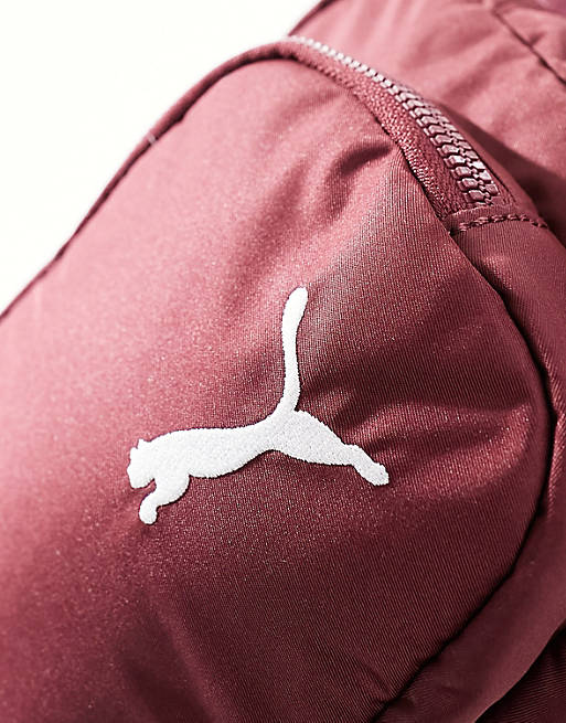 Puma Core her compact cross body bag in dark jasper | ASOS