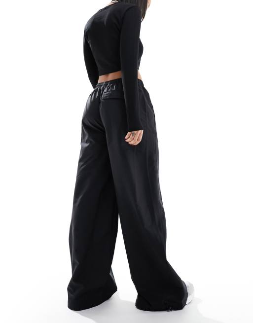 Puma Dare To woven parachute pants in black | ASOS