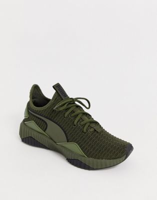 Puma Defy trainers in green | ASOS