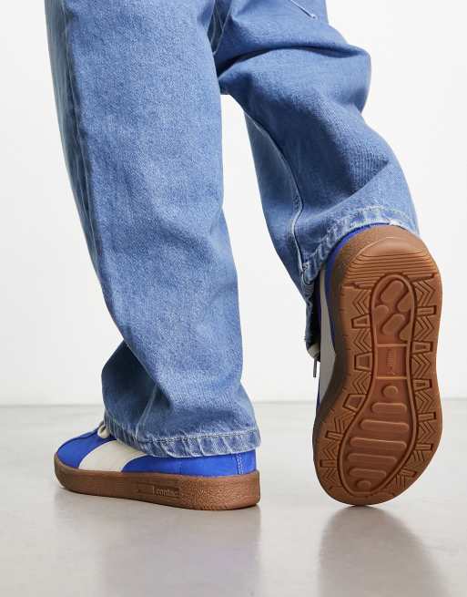 PUMA Delphin sneakers in royal blue with gum sole