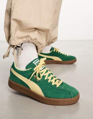 Puma Delphin trainers in green with gum sole