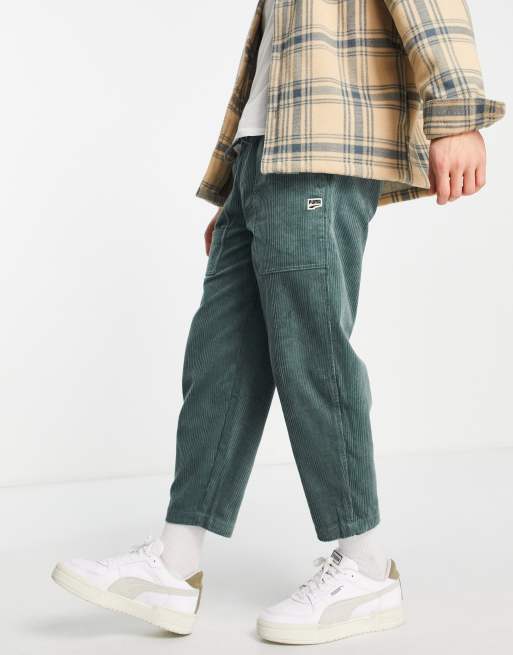 Puma Downtown cord trousers in dark green