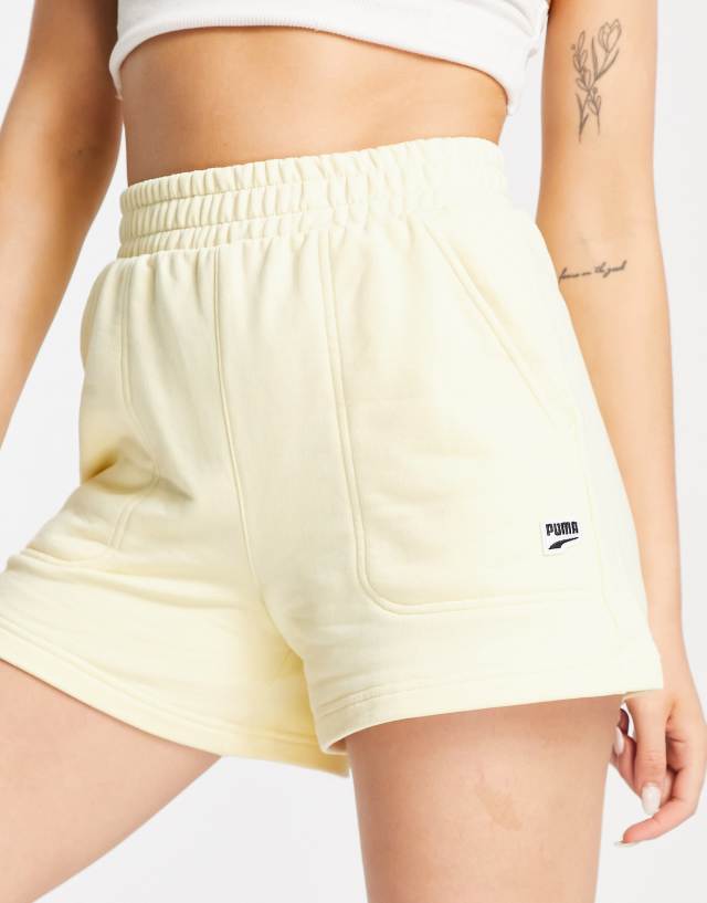 PUMA downtown high rise shorts in pale yellow