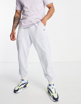 Puma Downtown joggers with checkerboard pocket in pale blue