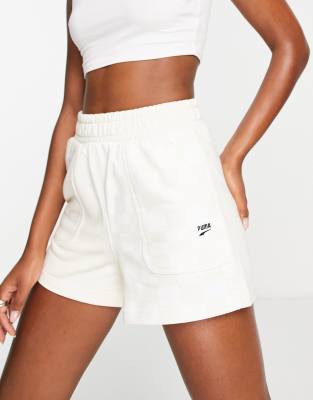 Puma Downtown sweat shorts in checkerboard colour block in beige and white