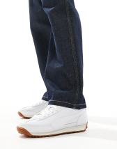 PUMA Roma sneakers in white with green