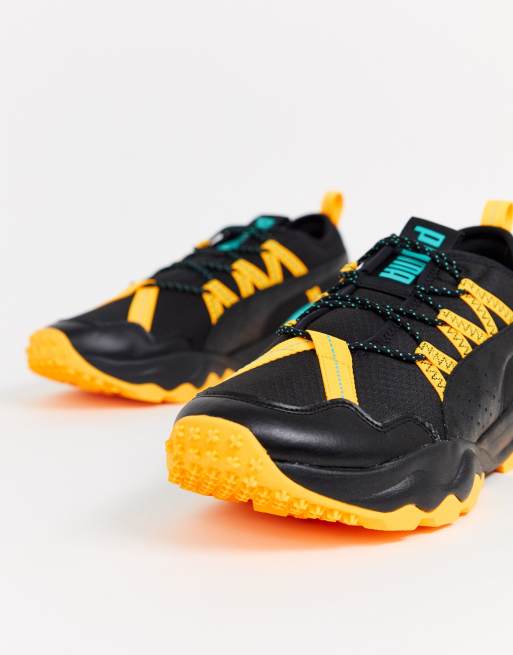 black and yellow puma suede