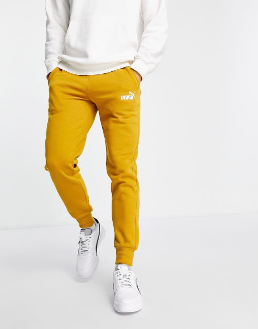 Puma Essentials joggers in ochre exclusive to ASOS ASOS