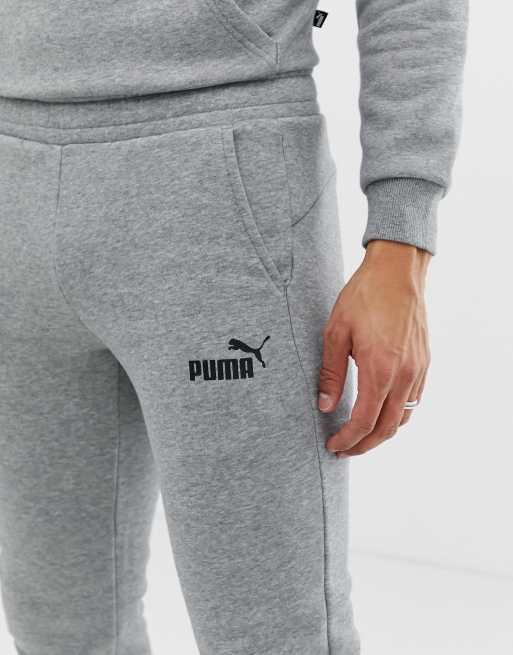 PUMA Essentials Joggers slim grigi con logo piccolo ASOS