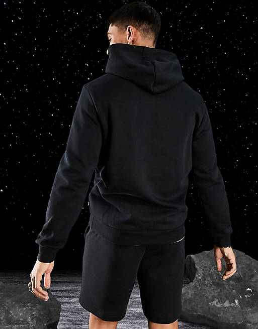 Puma Essentials large logo hoodie in black | ASOS