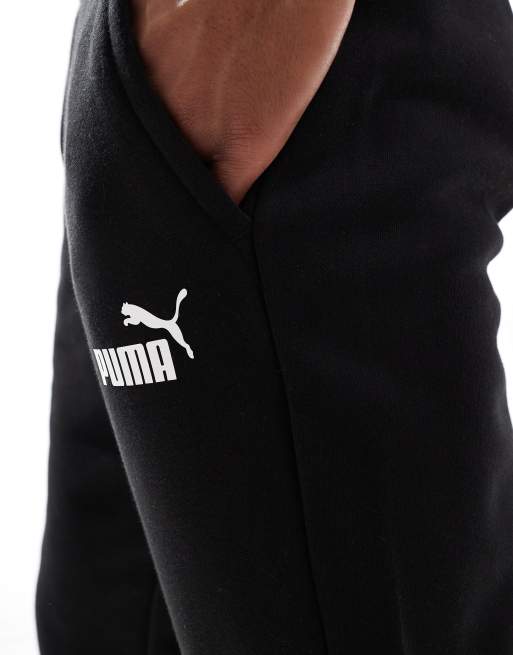 Puma Essentials logo fleece joggers in black