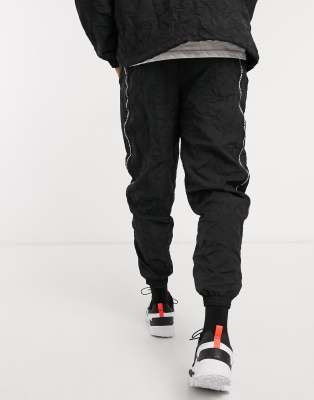 puma joggers black and white