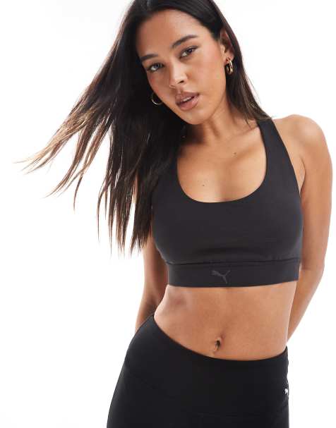 PUMA Evolve Training mid impact support sports bra in black - view 1