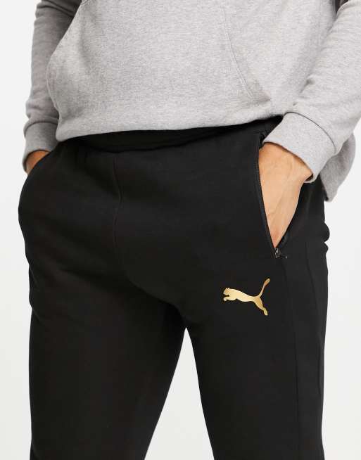 Puma - Evostripe - Joggers neri con logo oro, 3 di 4