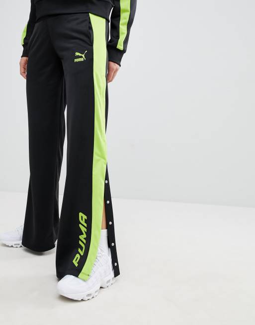 Black and lime store green track pants