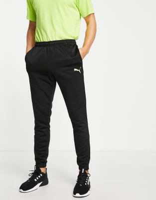 Puma Puma Football joggers 1/4 zip in black with yellow pop
