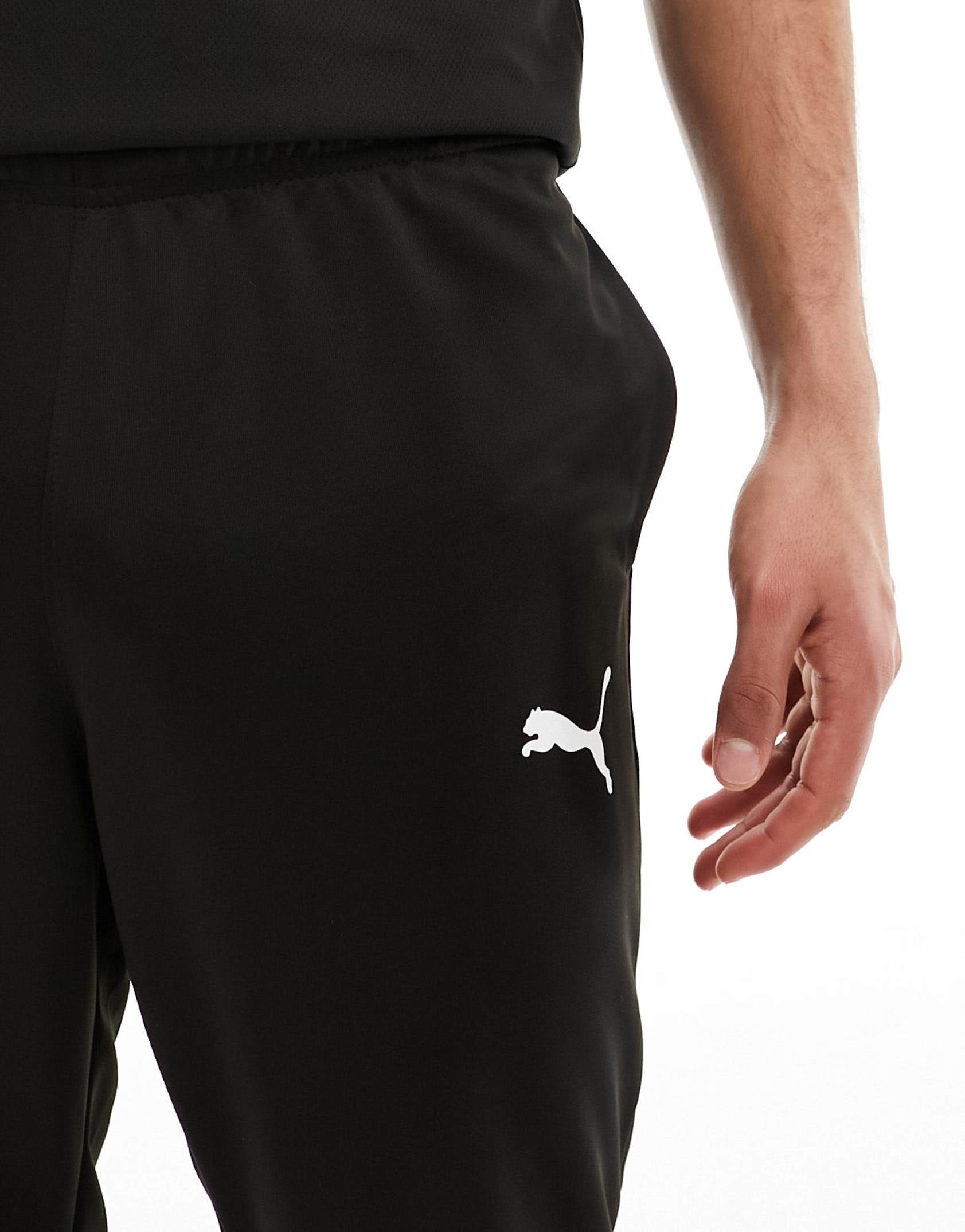 Puma football joggers in black sale