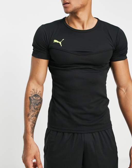 PUMA – Football Rise – Sport-T-Shirt in Schwarz mit Detail in leuchtendem Gelb