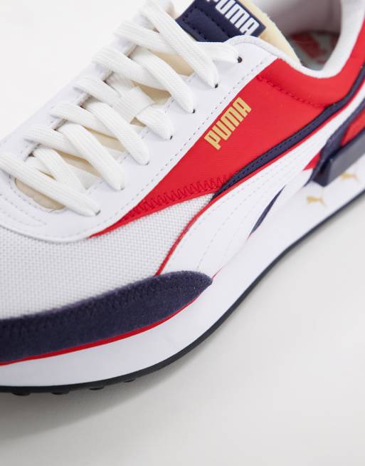 Red white and store blue puma sneakers