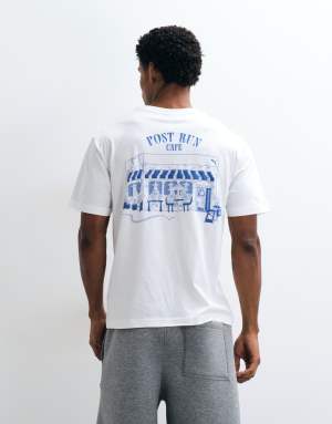 Puma Graphic cafe relaxed tee in white