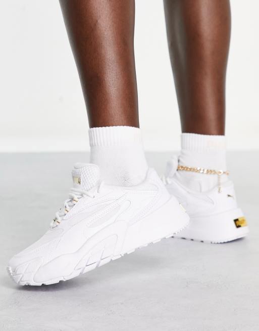 PUMA – Hedra – Sneaker in Weiß und Gold