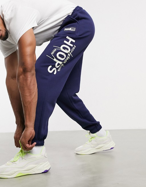 Puma Hoops slouchy graphic joggers in navy