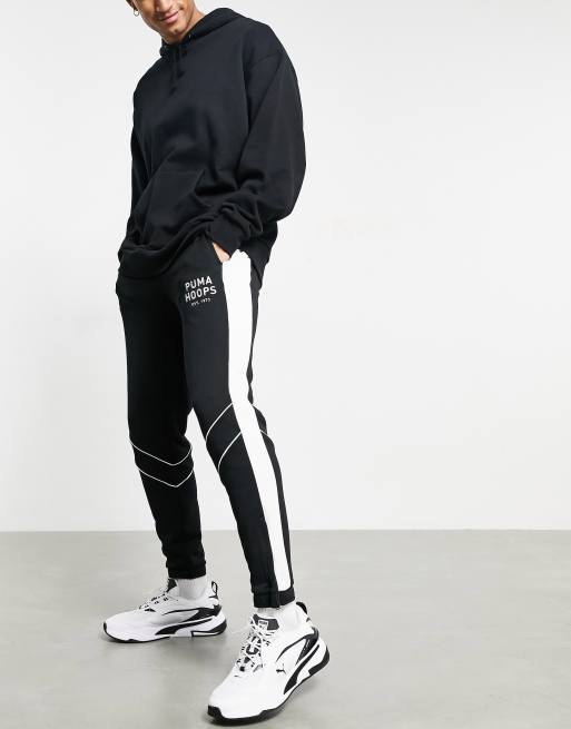 Puma Hoops track pants in black | ASOS