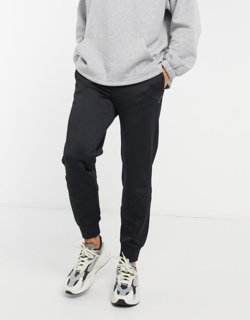 PUMA Iconic MCS logo trackies in black | ASOS