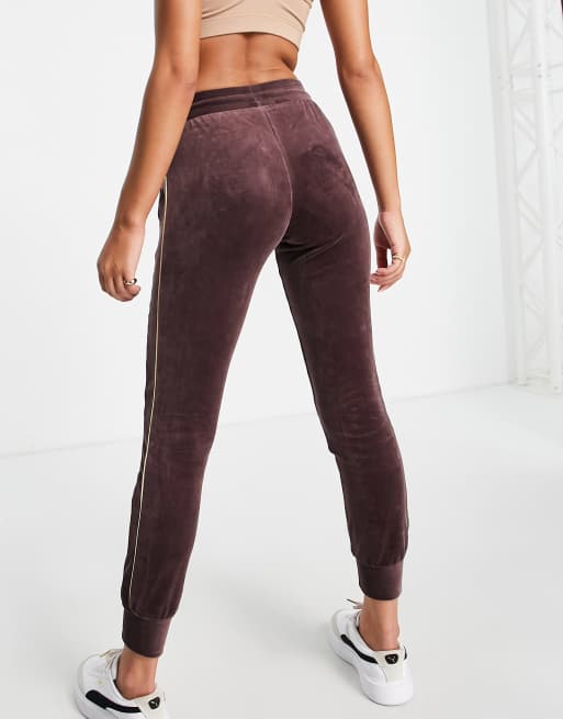 Puma Iconic T7 velour joggers in burgundy and gold