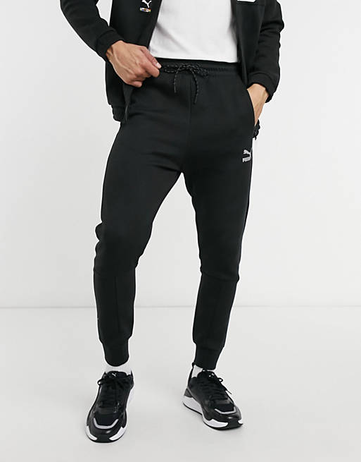 Puma International logo track pants in black | ASOS
