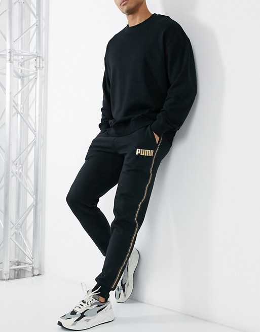 Puma joggers in black with gold taping